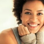 Captivating portrait of a smiling woman with a warm and friendly expression.